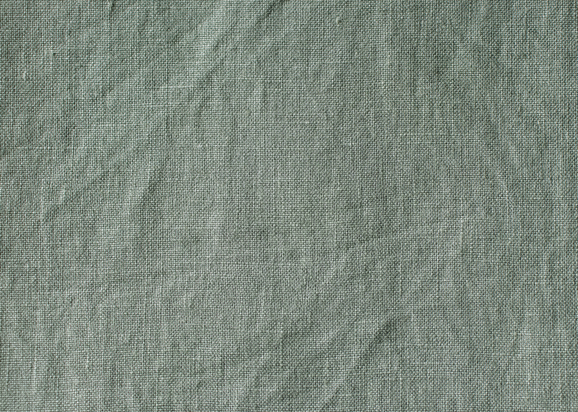 Sage green linen fabric texture swatch